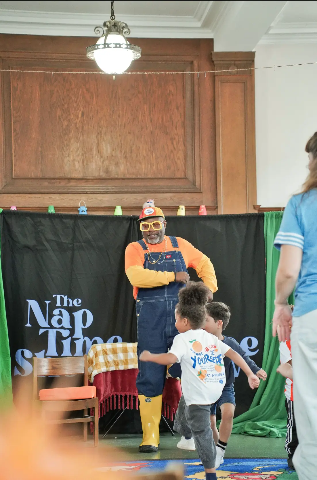 Mr. Boots and children dancing together at The Naptime Show